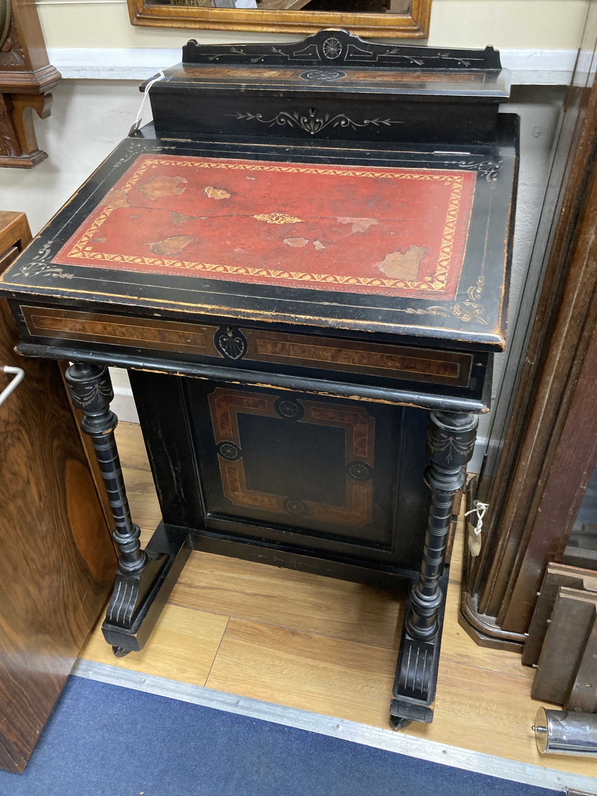 A late Victorian ebonised and amboyna Davenport, width 55cm, depth 56cm, height 86cm